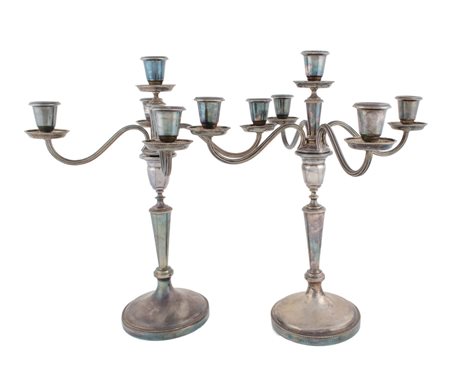 COPPIA CANDELABRI a cinque fiamme in argento (g. 1970). Italia XX secolo...
