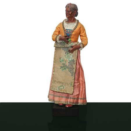 Personaggio presepiale in terracotta e legno con vesti in cotone, raso e passamaneria: massaia popolana con fiocco in testa , Naples 19° secolo