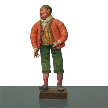 Personaggio presepiale in terracotta e legno con vesti in cotone, raso e passamaneria:  uomo con giacca  arancione e pantaloni verdi, Naples 19° secolo