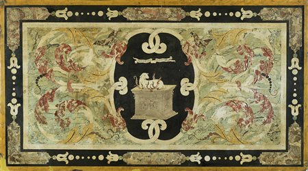 Piano in scagliola decorato in policromia sul bordo a riserve in finto marmo...