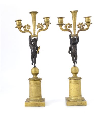 OGGETTISTICA VARIA COPPIA DI CANDELABRI IMPERO IN BRONZO DORATO E BRUNITO,...