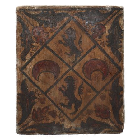 Placca Socarrat Valenziano  in argilla cotta raffigurante leoni araldici, lune e fiori.