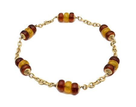 Collana in oro e pasta vitrea Oro giallo 750/000. Peso complessivo gr. 69...