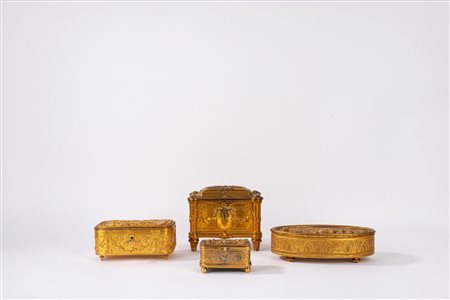 Lotto composto da quattro scatoline in bronzo dorato