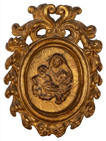 Bassorilievo raffigurante Madonna con Bambino entro cornice lignea intagliata e dorata, secolo XVIII