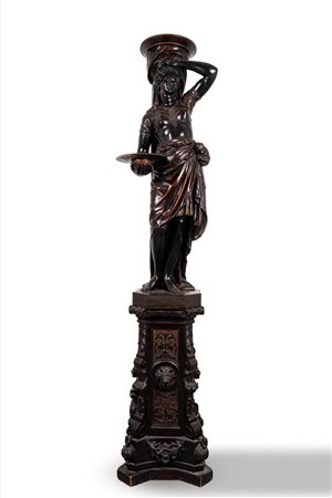 Grande scultura reggitorcia in legno ebanizzato raffigurante schiava moresca, secolo XIX