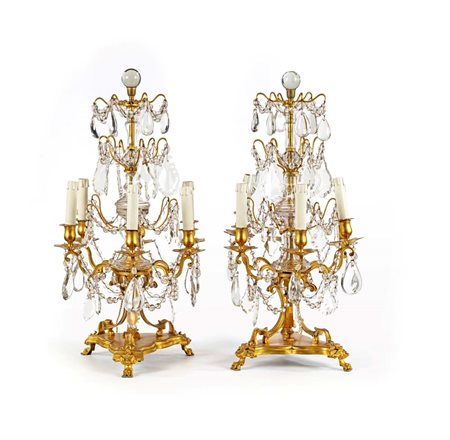 Coppia di girandoles in bronzo dorato e cristallo a sei luci, XIX secolo...