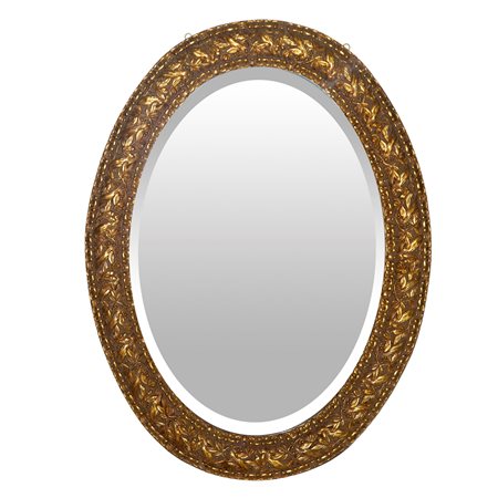 Specchiera ovale entro cornice dorata decorata con motivi vegetali e nastro