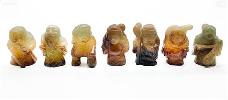 Gruppo di sette figure popolari in giada intagliata 
Cina, secolo XX
(h. max cm