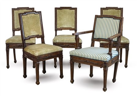Lotto composto da quattro sedie e una poltrona in noce con fasce decorate da in