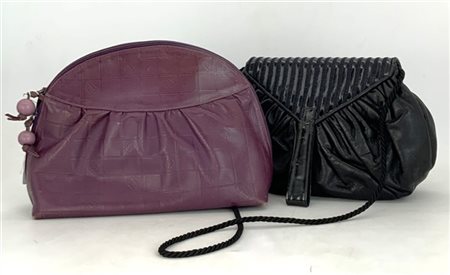 FENDI 
Lotto composto da una clutch in pelle color nero chiusa con patella loga