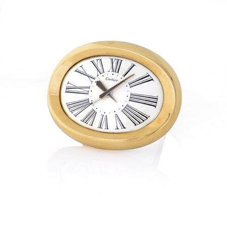 CARTIERCARTIER LONDON SVEGLIA FINE ANNI '60. C. ovale in ottone dorato con...