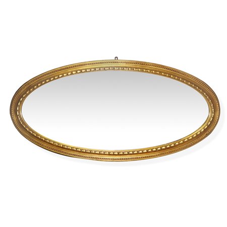 Grande specchiera ovale in cornice dorata