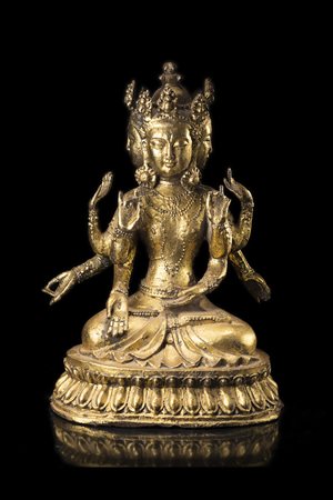 Avalokitesvara dai molti volti in bronzo dorato, le molteplici mani in...