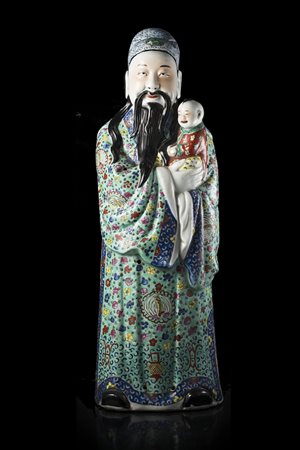 Statua in porcellana policroma raffigurante una divinità dalla lunga barba...