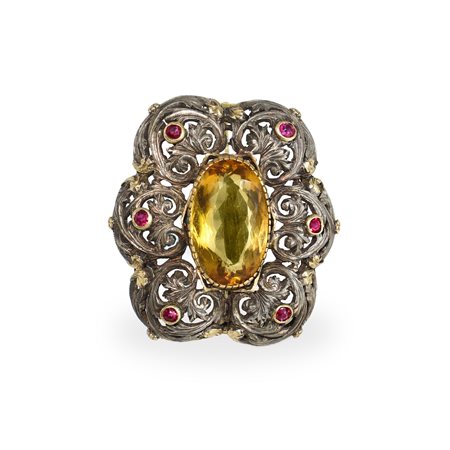 Spilla in oro basso titolo e argento con rubini e topazio centrale