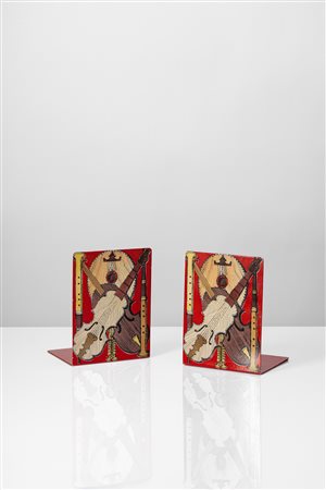 Piero Fornasetti (Milano 10/11/1913 - Milano 09/10/1988)  - Coppia di fermalibri 'Strumenti Musicali', 1960 circa