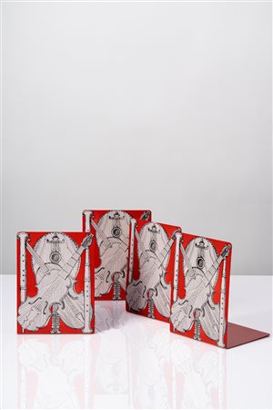 Piero Fornasetti (Milano 10/11/1913 - Milano 09/10/1988)  - Set di quattro fermalibri 'Strumenti musicali', 1960 circa