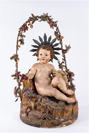 Gesù bambino seduto su base rocciosa con agnello  accovacciato in terracotta e cartapesta policroma. Italia meridionale, secolo XVIII (h cm 45 circa)
