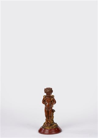 Fauno in bronzo dorato e patinato su base in marmo rosso. Secolo XIX