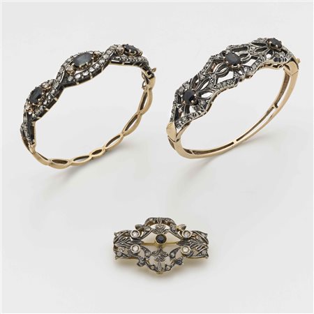 Lotto composto da due bracciali rigidi in oro 500/1000 e argento con diamanti...