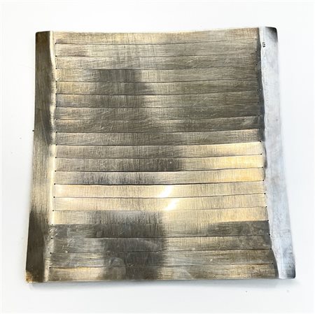 Firma indecifrata. Pannello in argento, titolo 925 (g. 595)
cm 28,5x28,5
firmat