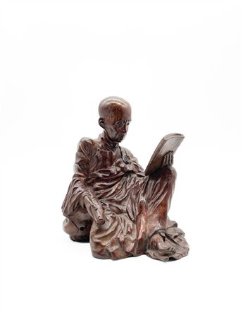 Figura di monaco lettore in legno verniciato
Vietnam, probabilmente scuola di H
