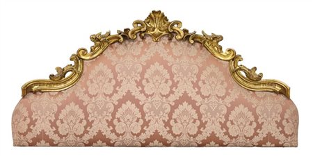 Testiera da letto in legno intagliato e dorato a volute contrapposte e teste d'