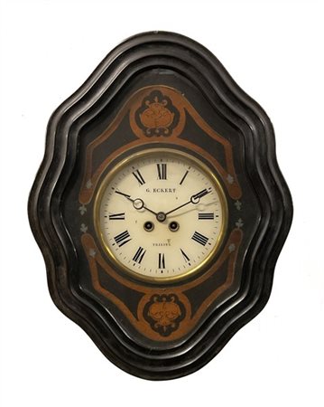 G. Eckert, Trieste. 
Orologio a occhio di bue con cassa in legno e mostra con i