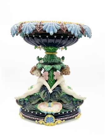 Centrotavola in ceramica policroma con coppa ovale, sostegno a tronco fogliato