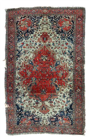 Tappeto Sarouk, Persia, fine secolo XIX. Decoro con grande medaglione rosso con