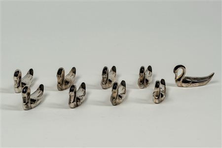 Nove poggia posate in forma di cigno in metallo argentato