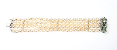  
Bracciale in oro con perle, diamanti e smeraldi 
 