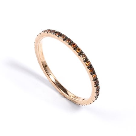  
Anello in oro e corindoni arancioni 
 