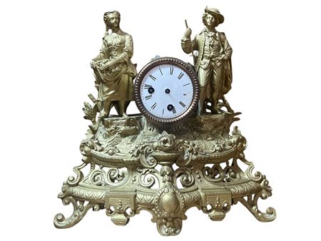 Orologio da tavolo con "Coppia di villanelli" in metallo dorato – XIX Secolo