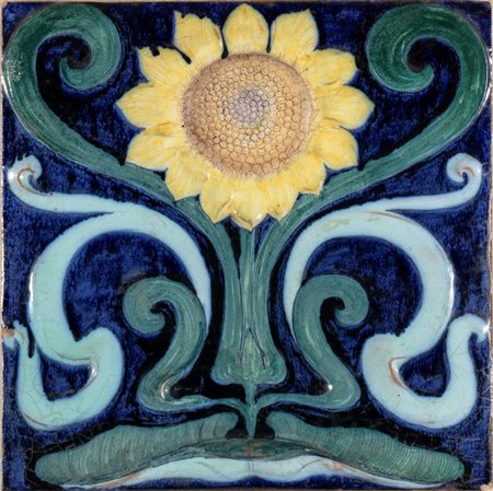 GALILEO CHINI (Firenze 1873 - 1956), Mattonella con decorazione di girasole