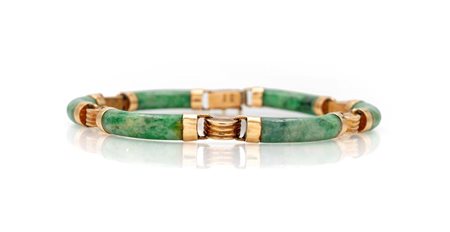 Bracciale in oro e giada Oro giallo 585/000. Peso complessivo gr. 14,40...