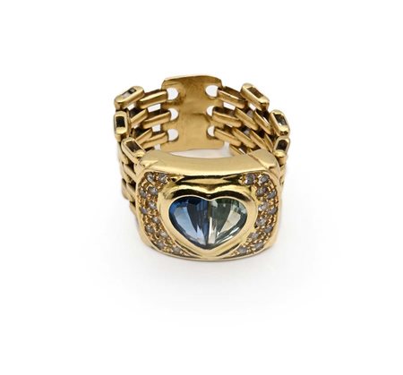 Anello in oro, topazio, peridoto e brillanti Oro giallo 750/000. Peso...