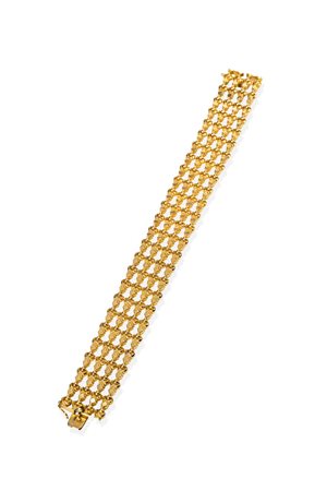 BRACCIALE in oro giallo, anni '50, lavorato a motivi geometrici. Punzonato...
