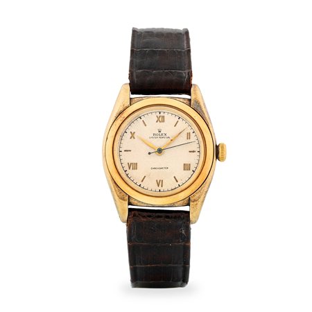 Rolex, Oyster Perpetual Ovetto ref. 3131 in oro giallo 14k, quadrante argentè...