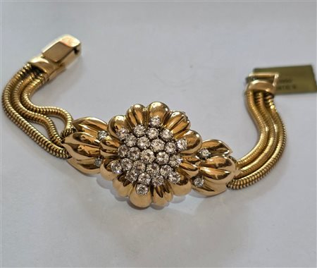 Importante bracciale-orologio in oro giallo e diamanti