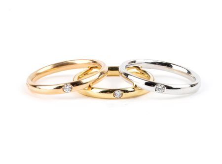 POMELLATO Collezione Lucciole: tre anelli in oro con diamanti In oro bianco,...