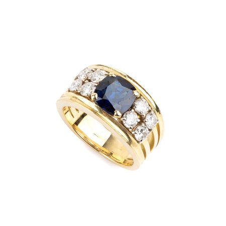 Anello in oro con zaffiro centrale e diamanti Modellato come una fascia in...
