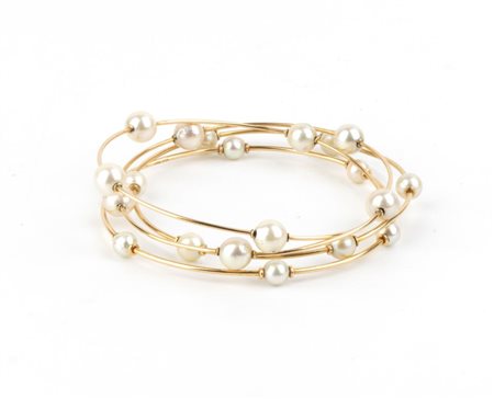 Quattro bracciali a cerchio in oro e perle metà XX secolo In oro giallo,...