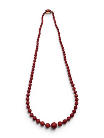 Collana di corallo con chiusura in oro giallo Ad un filo di sfere di corallo...