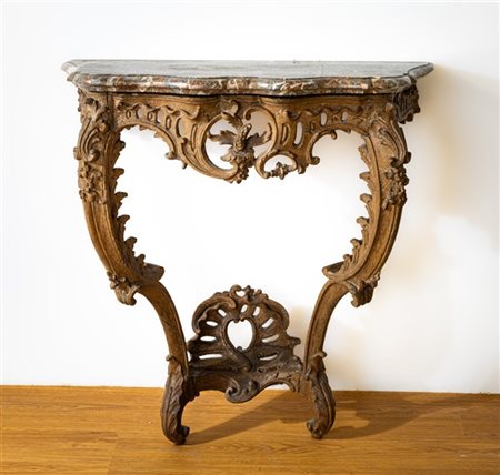 Console in rovere intagliato e traforato con gambe a doppia voluta contrapposta