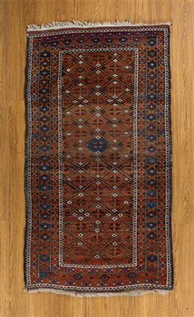 Tappeto Beluchistan, Persia, secolo XX. Decoro geometrico con file di Gul rossi