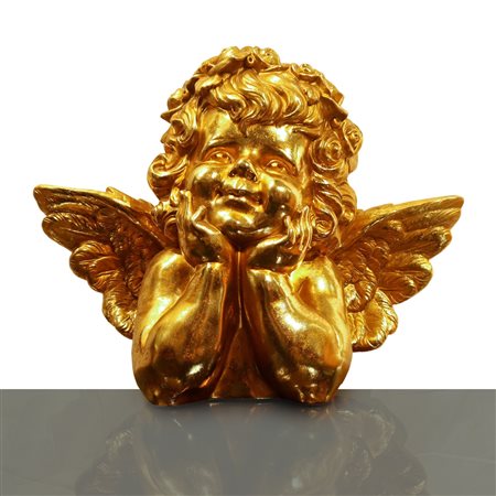 Puttino ornamentale dorato in posizione pensante