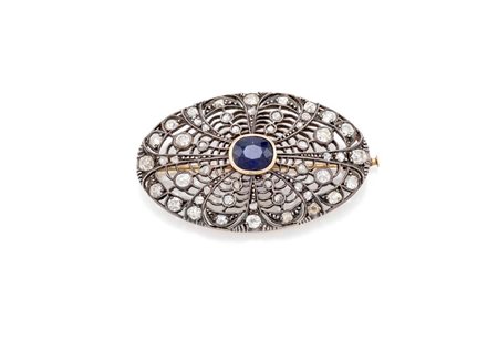  
Spilla ovale in oro, argento diamanti e zaffiro 
 cm 3 x 5