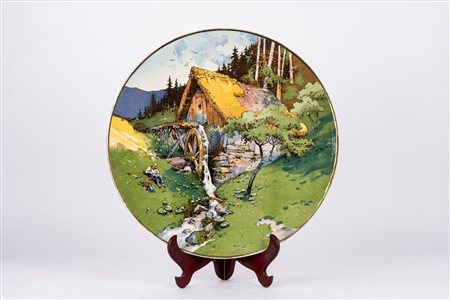Grande piatto in porcellana policroma decorato con paesaggio montano